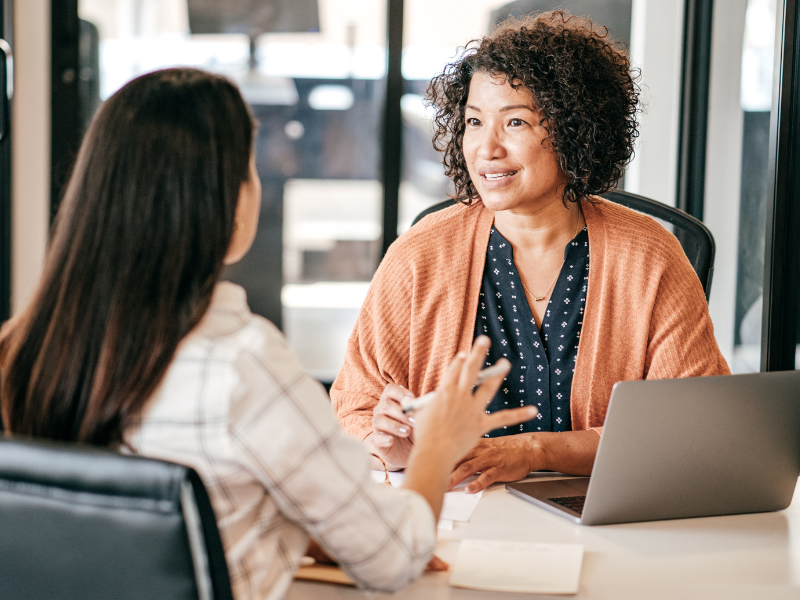 Two women in an interview at a job fair